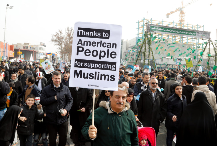 Image: Iranians mark the 38th anniversary of the 1979 Islamic revolution in Tehran, Friday.