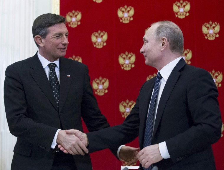 Image: Vladimir Putin (R) shakes hands with his Slovenian counterpart Borut Pahor following talks at the Kremlin on Friday.
