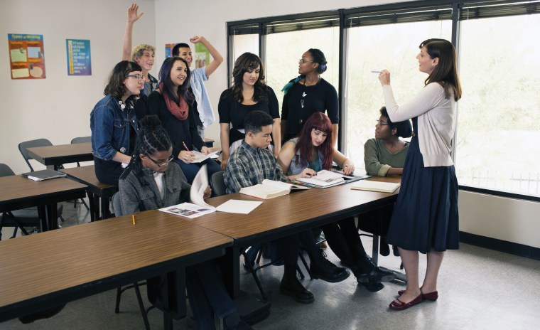 Teacher instructing a high school class.