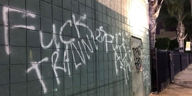Image: Graffiti is seen painted across an exterior wall of the Los Angeles LGBT Center.