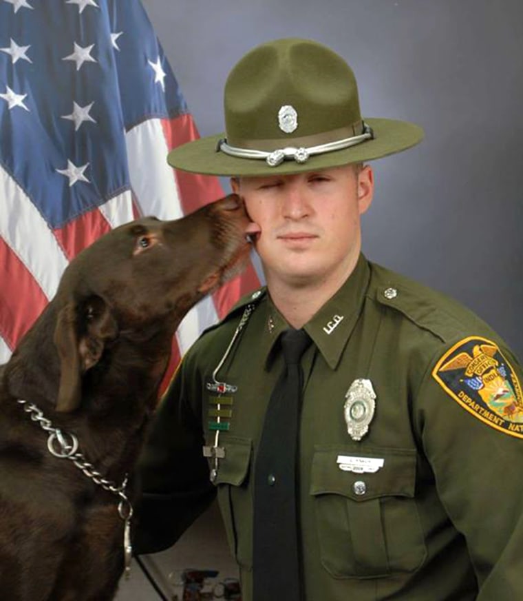K9 officer didn't get the memo that official portraits are serious business