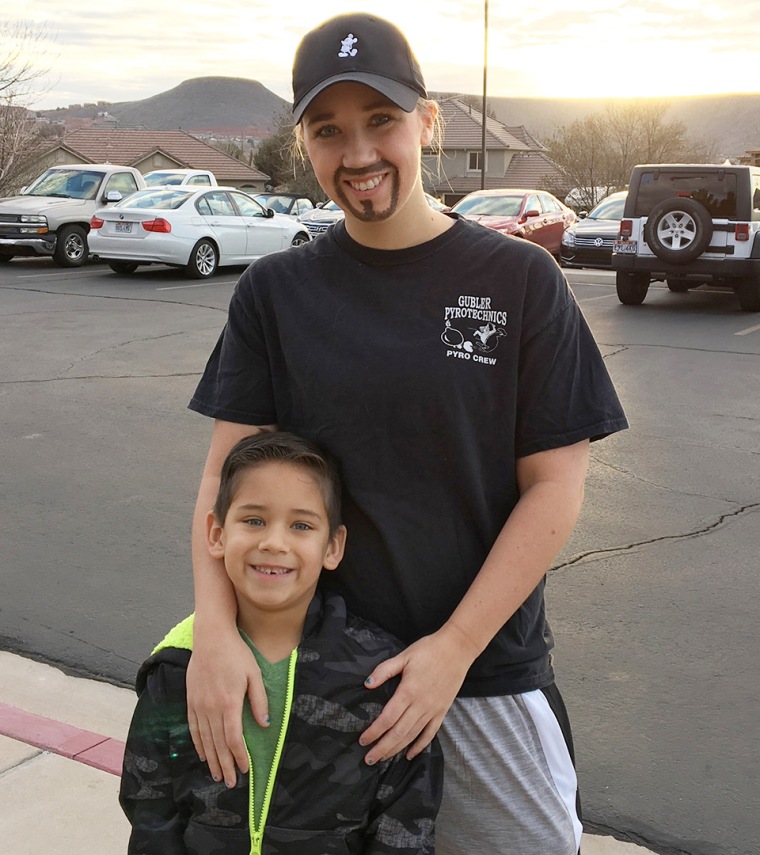 Whitney Kittrell with her son Lucas while dressed for a dads and doughnuts day at his school.