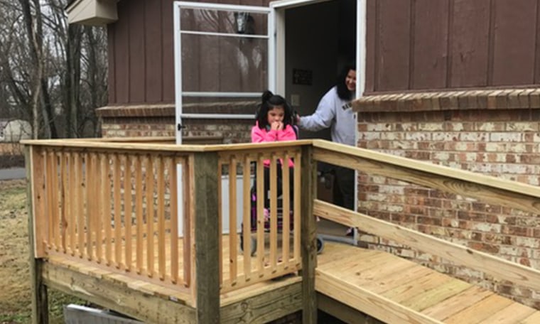 Verna DeSpain helps Lydia go outside and use the ramp for the first time