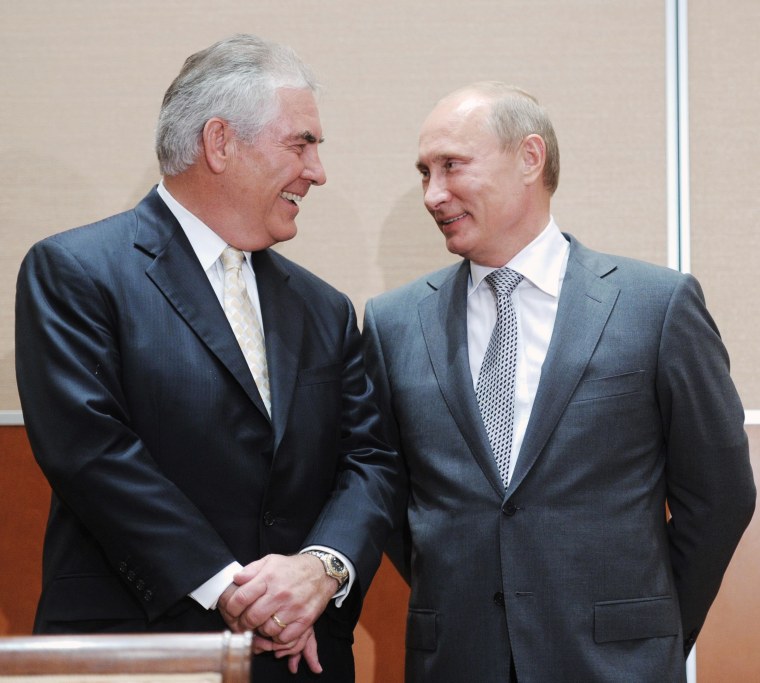 Image: Rex Tillerson and Vladimir Putin attend a meeting in August 2011