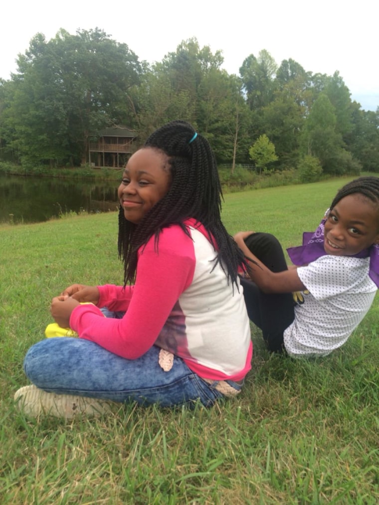 Takiya Holmes, 11, left, was killed in a shooting in February.