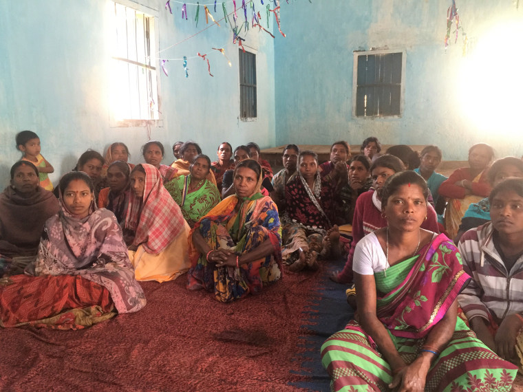 Women gather to discuss their habits and beliefs around menstruation in Dumandih village, in India's eastern Jharkhand State.