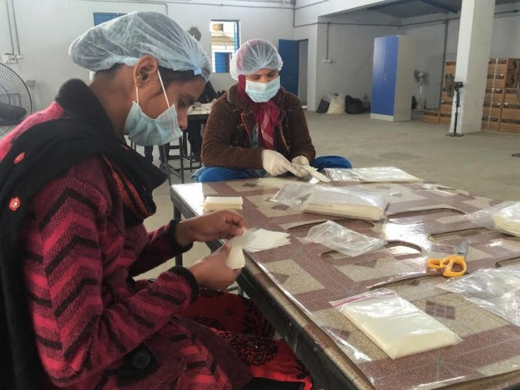 Women work at the Saathi Pads factory in Ahmedabad, India.