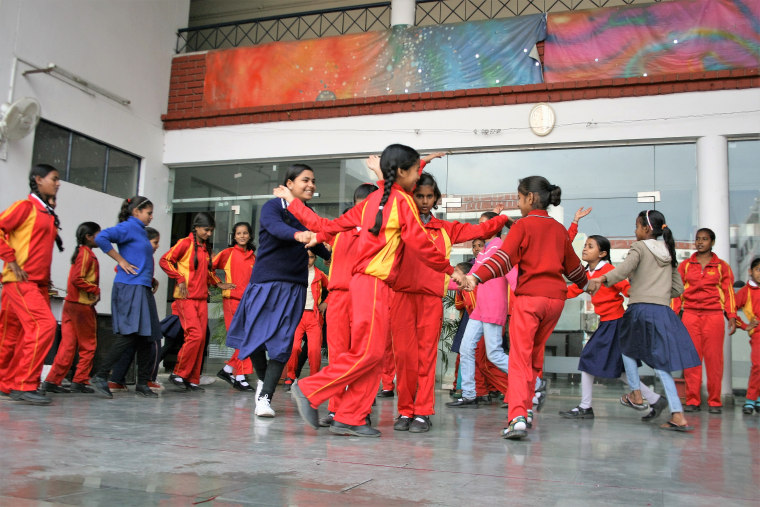 Students enrolled in Prerna Girls School practice for an upcoming concert in Lucknow, India.