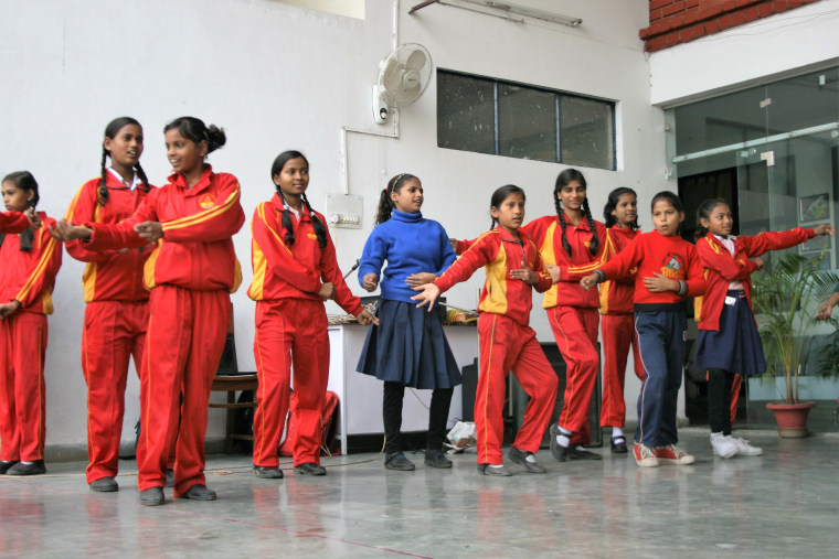 Students enrolled in Prerna Girls School practice for an upcoming concert in Lucknow, India.