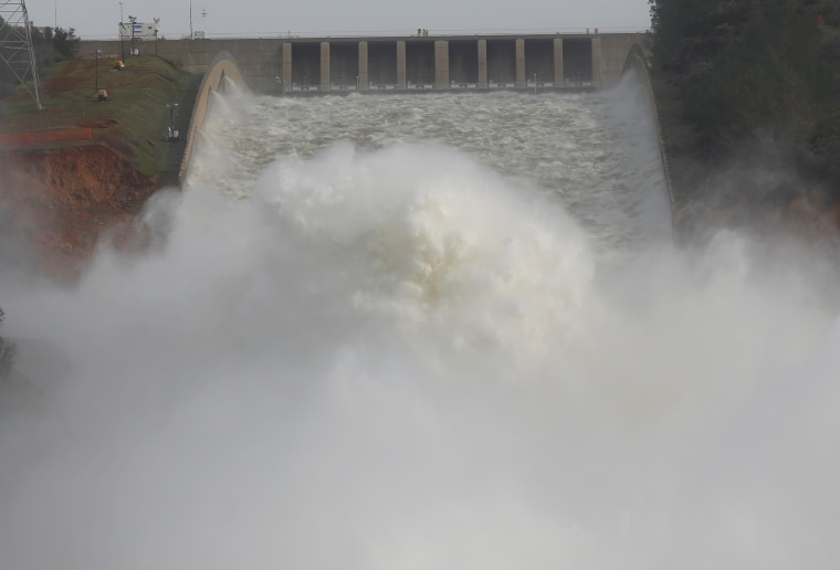 Image: Water is released from the Lake Oroville Dam after an evacuation was ordered for communities downstream from the dam in Oroville, California