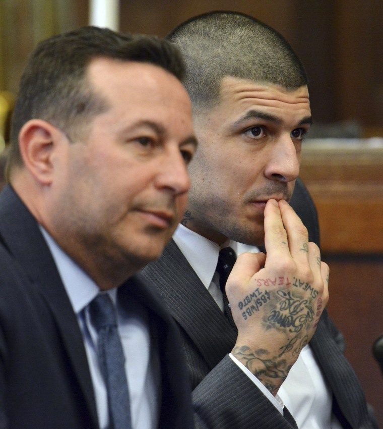 Image: Lead defense attorney Jose Baez, left, and Aaron Hernandez listen to Judge Jeffrey Locke