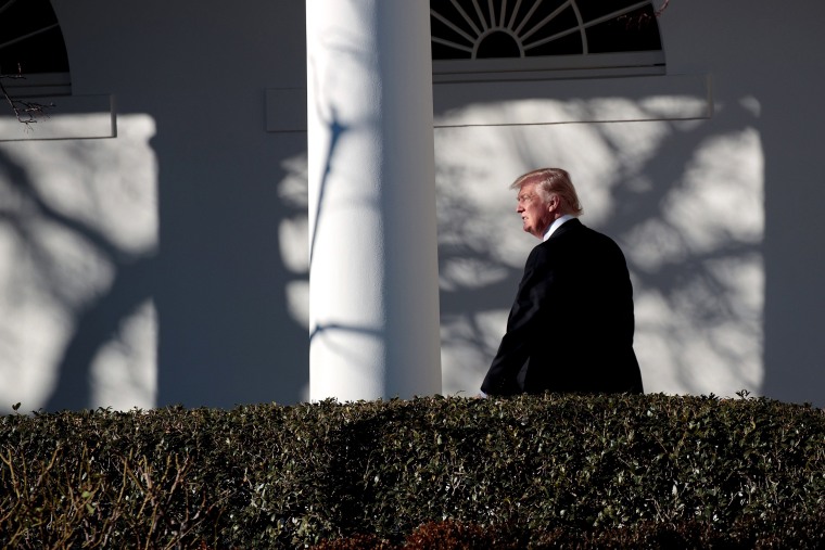 Image: Trump walks along the west wing colonnade on his way to the Oval Office