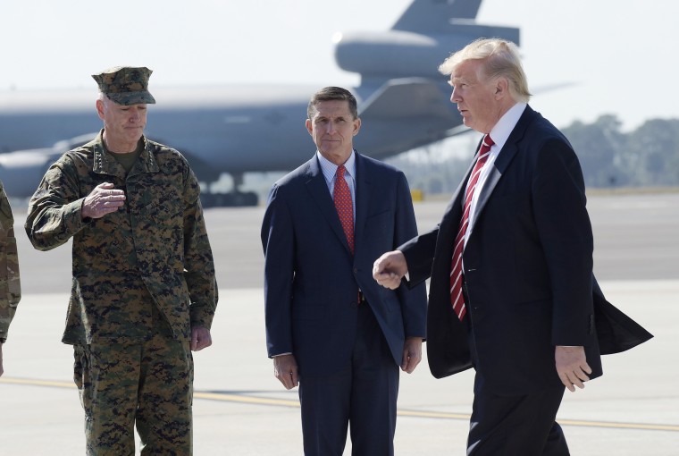 Image: Trump passes National Security Adviser Michael Flynn