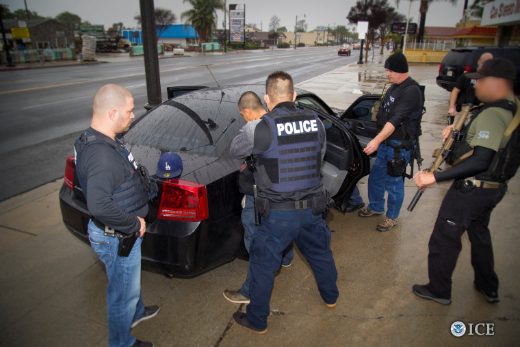 Image: ICE officers detain a suspect as they conduct a targeted enforcement operation in Los Angeles