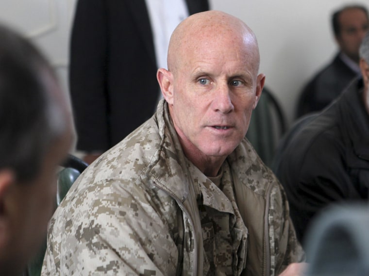 Image: In this image provided by the U.S. Marine Corps, Vice Adm. Robert S. Harward, commanding officer of Combined Joint Interagency Task Force 435, speaks to an Afghan official during his visit to Zaranj, Afghanistan, Jan 6, 2011.
