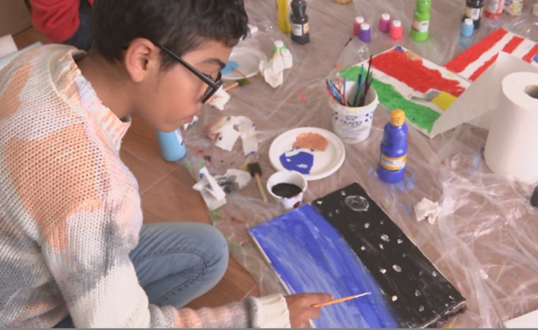 Image: Child from Nea Kalava refugee camp paints