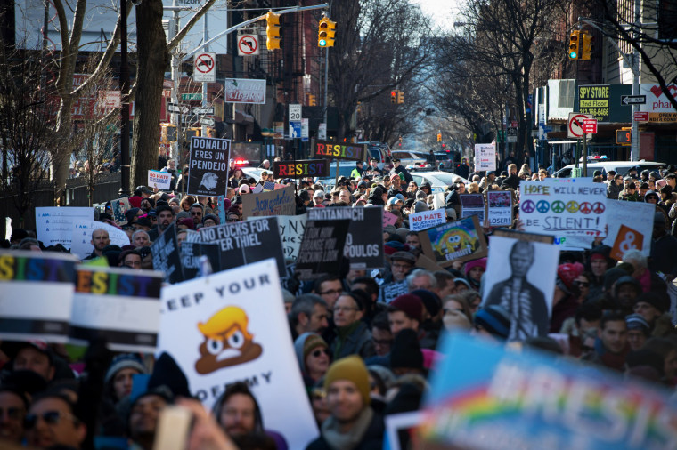 Image: People protest at a rally in front of the Stonewall Inn in solidarity with immigrants, asylum seekers, refugees, and the LGBT community on Feb. 4, 2017 in New York.