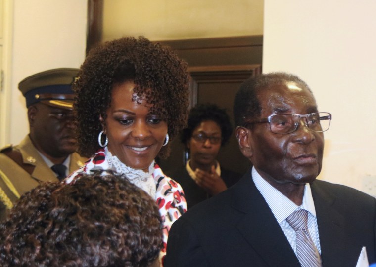 Image: President Robert Mugabe and his wife Grace arrive to chair ZANU PF's Politburo meeting at the party headquarters in Harare