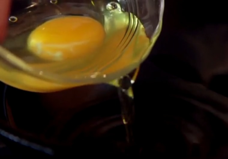 Drop egg into pool of oil