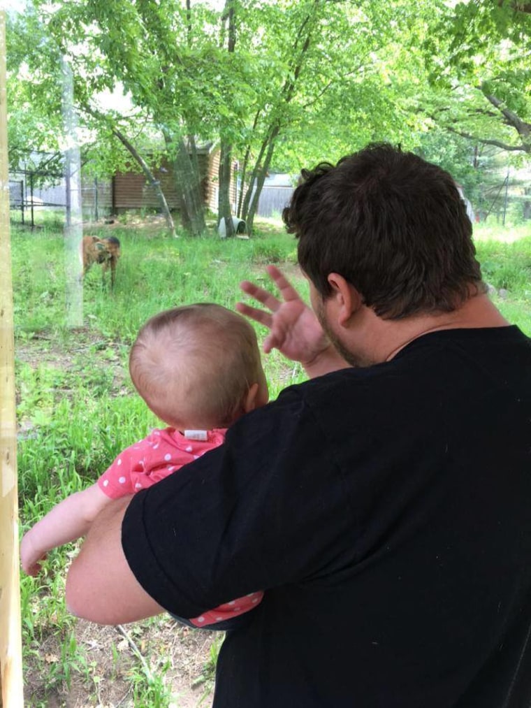 Kevin teaches Bayleigh how to sign "wolf."