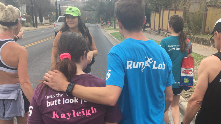 About two dozen people supported Kayleigh Williamson as she ran her half marathon, including staff from RunLab Austin, her personal trainer and friends from the Special Olympics. 