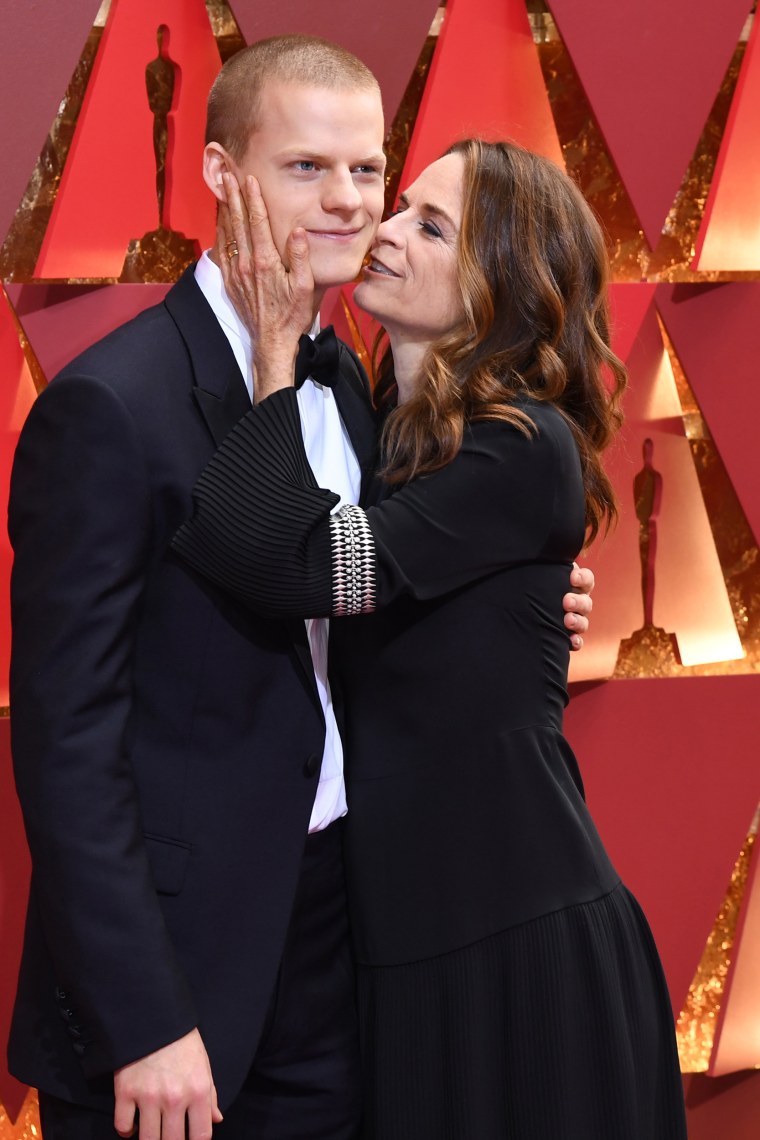 Lucas Hedges and his mother on the Oscars red carpet