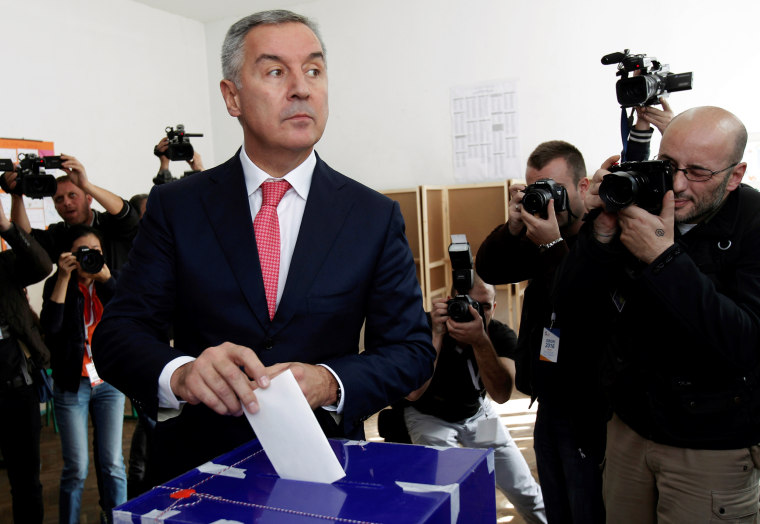 Image: Montenegrin Prime Minister casts his ballot at a polling station in Podgorica