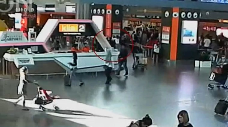 Image: Video grab appears to show a man purported to be Kim Jong Nam being accosted by a woman in a white shirt at Kuala Lumpur International Airport in Malaysia