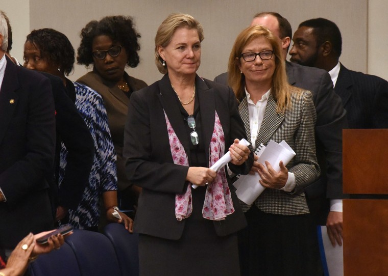 Deb Butler, center, stands with eight other nominees as she was selected to fill the N.C. House seat vacated by former Rep. Susi Hamilton, Wednesday Feb. 1, 2017, in Wilmington, N.C..