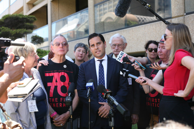 State lawmaker Alex Greenwich speaks to reporters and members of the LGBTQ community at New South Wales Parliament House