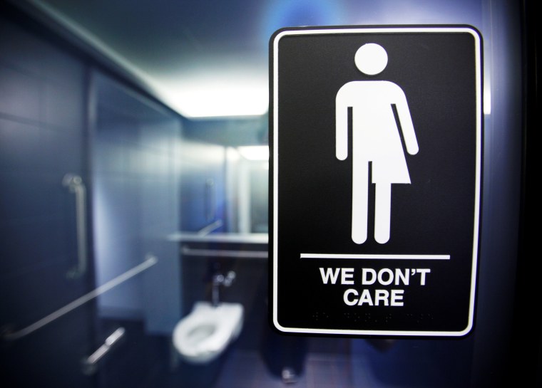 A sign protesting a recent North Carolina law restricting transgender bathroom access adorns in Durham.
