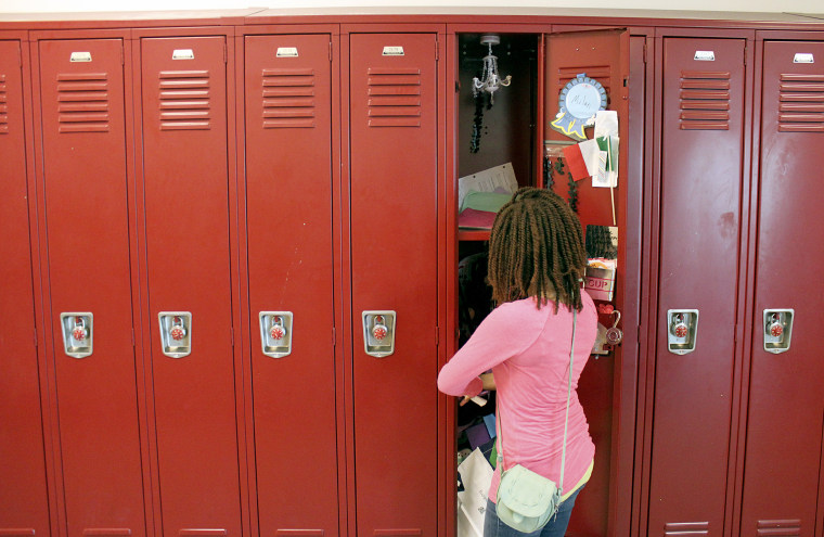 Image: A sixth grader empties her locker on June 20, 2014, the last day of class at Alice Deal Middle School in Northwest D.C.