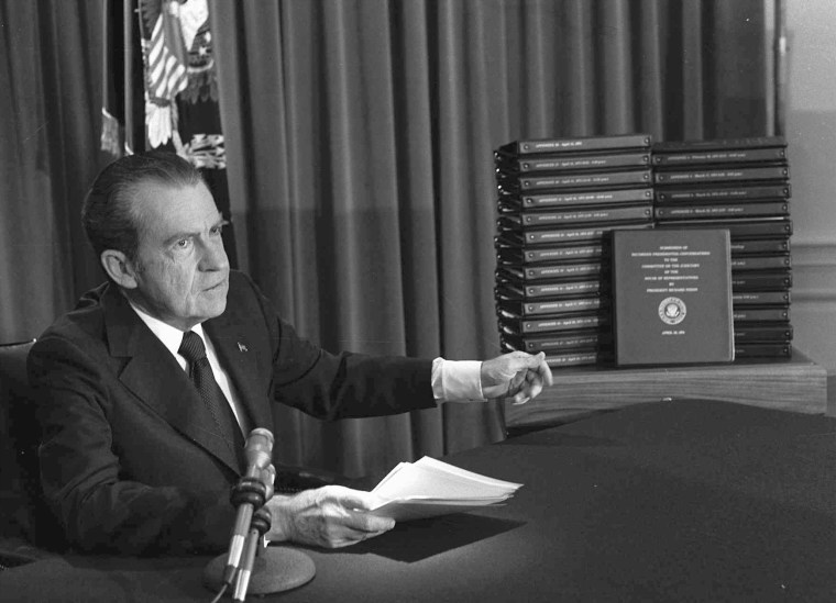 Image: President Richard M. Nixon is shown pointing to the transcripts of the White House tapes in this April 29, 1974, file photo.