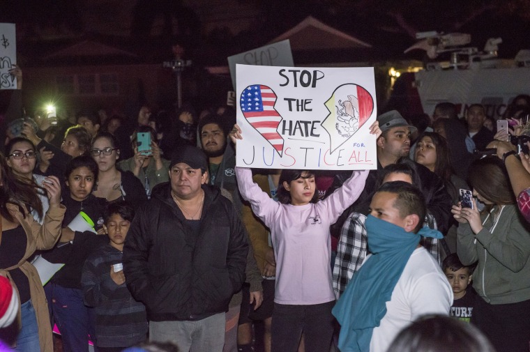 Image: Protesters gathered outside the off-duty LAPD officer's home in Anaheim.