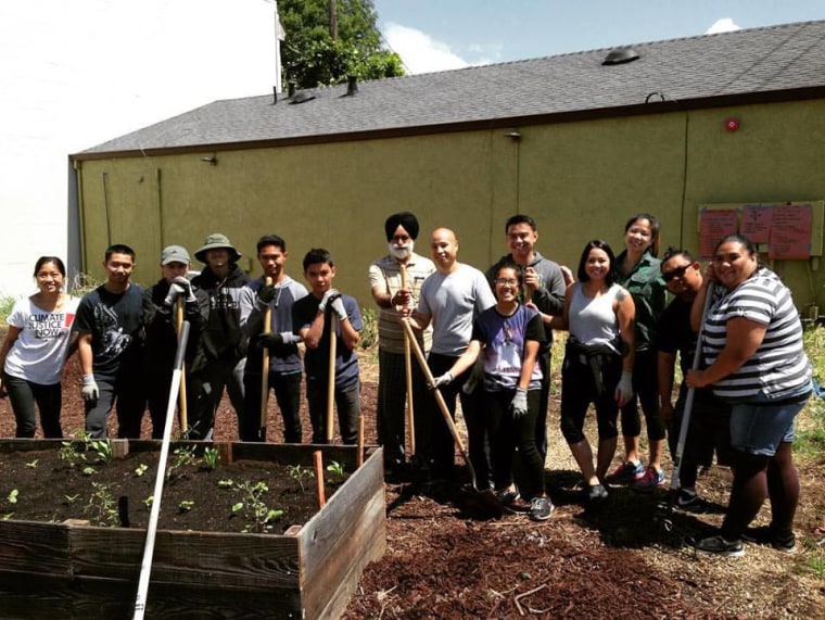 Suzara with community members from the Philippine Youth Coalition working on a community garden