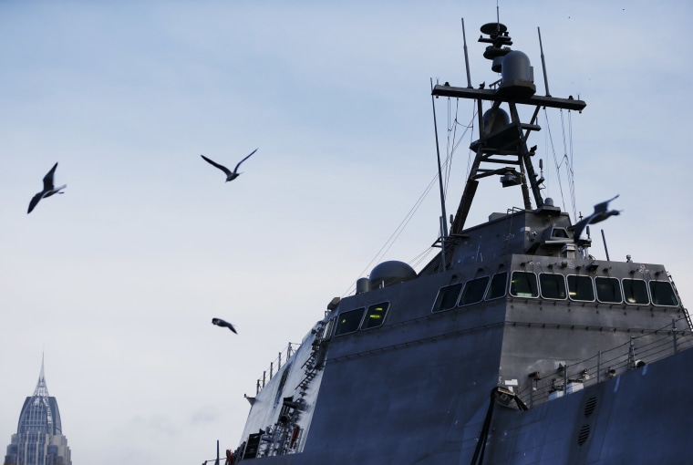 Image: Birds fly by a U.S. Naval littoral combat ship built docked on the Mobile River in Mobile, Ala., on Nov. 30, 2016.