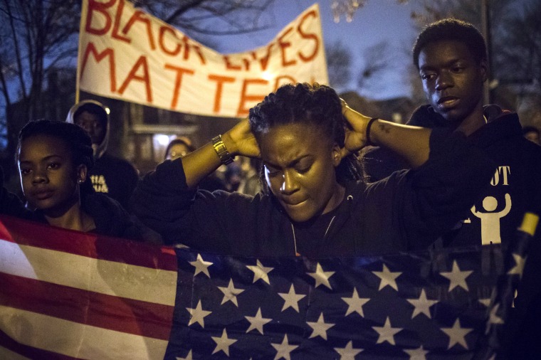 Image: Protesters, demanding the criminal indictment of a white police officer who shot dead an unarmed black teenager in August, march through a suburb in St. Louis, Missouri, Nov. 23, 2014.