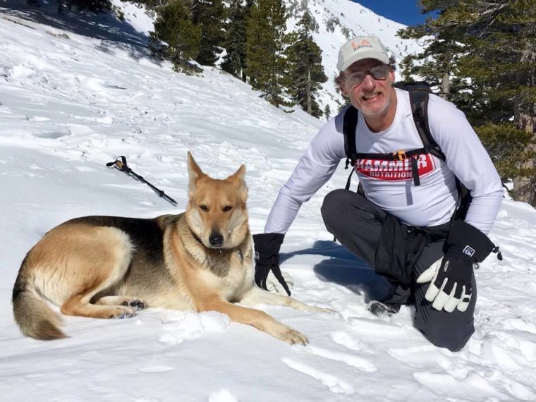 Warren Muldoon is pictured on a hike with Dakota the dog.