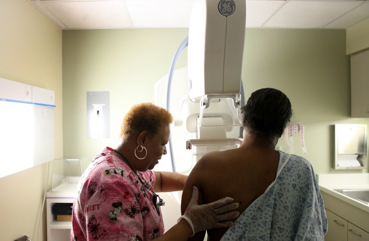 Image: A woman undergoes her yearly mammogram in Chicago.  