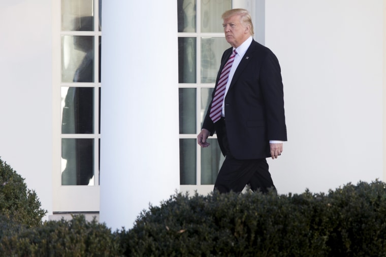 Image: Trump walks down the Colonnade of the White House