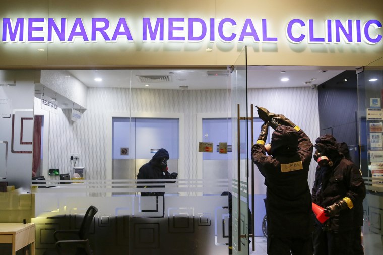 Image: A hazmat team investigates a clinic in Kuala Lumpur Internatinal Airport 