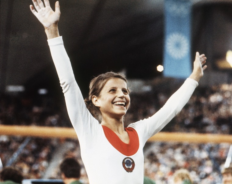 Image: Olga Korbut, of Russia, throws up her arms in joy after winning the Individual Women's Gymnastic event at the 1972 Summer Olympics in Munich, Germany, Aug. 1972