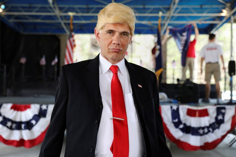 Image: Bobby Blaze, dressed as U.S. President Donald Trump, poses during a rally in Mandeville, Louisiana