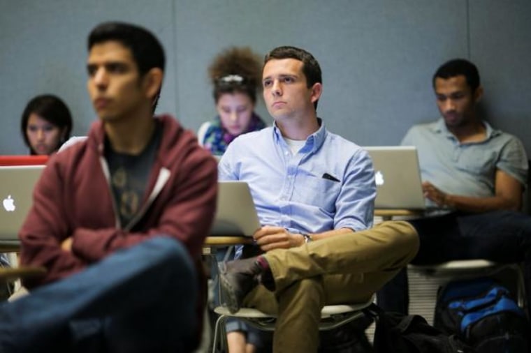 Students listen while classmates make presentation to group of visiting venture capitalists during Technology Entrepreneurship class in Stanford