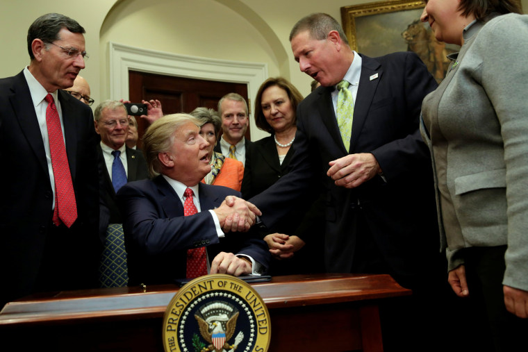 Image: U.S. President Donald Trump greets guests after signing the water executive order at the White House, in Washington