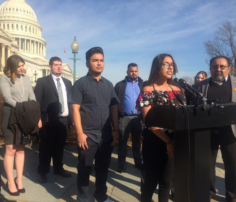Jacqueline Rayos Garcia discusses her mother's deportation as her brother Angel, left, looks on.