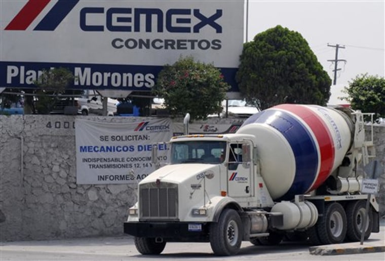 A cement truck leaves the Cemex SA cement distribution center in Monterrey, Mexico, June 7, 2007.