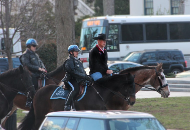 Image: The new Department of the Interior Secretary Ryan Zinke rides a horse to work on his first day
