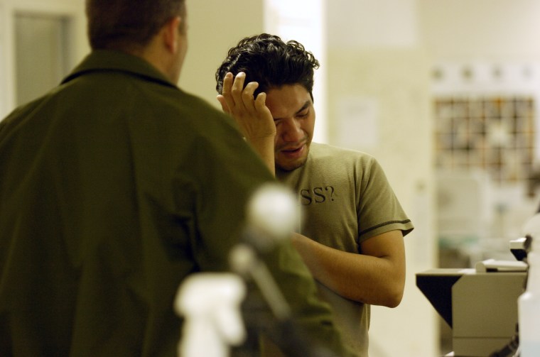 Image: Ronald Manolo Melendez is processed at the Eagle Pass Border Patrol Station in December 2006