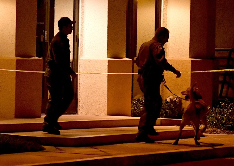 Image: Las Vegas Metropolitan Police Department K-9 officers search the Jewish Community Center of Southern Nevada after an employee received a suspicious phone call that led about 10 people to evacuate the building on Feb. 27, 2017.